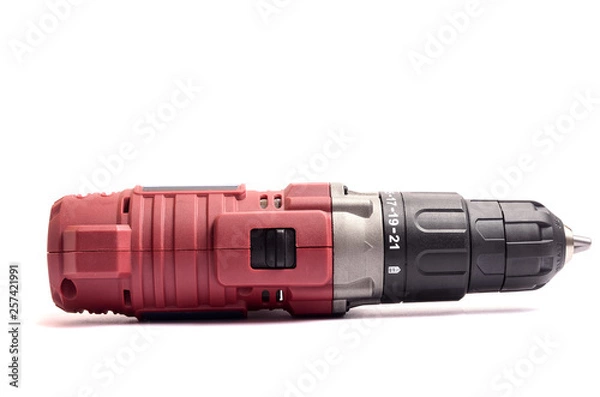 Fototapeta Cordless screwdriver with a drill isolated on white background