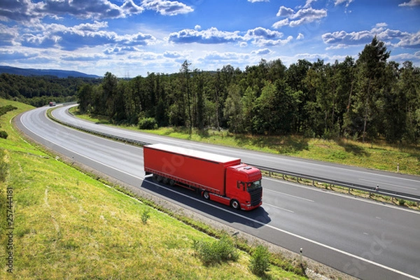 Obraz Red truck transport on the road and cargo