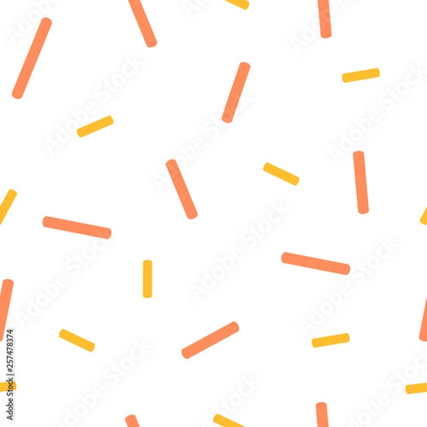 Fototapeta Yellow and orange candy on a white background, seamless pattern