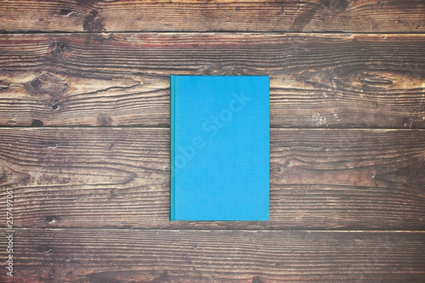 Fototapeta Blue book on table