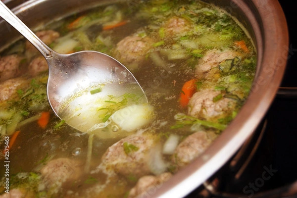 Obraz tasty soup with meat-balls in a saucepan