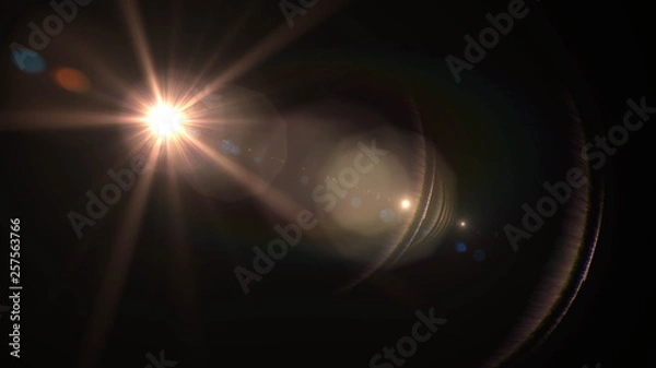 Fototapeta Lens flare  glow light effect  on black background. Easy to add overlay or screen filter over photos 