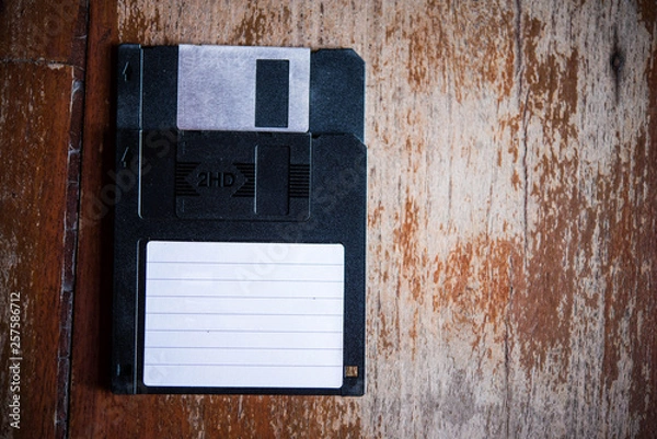 Fototapeta floppy disk on wood backgrounds