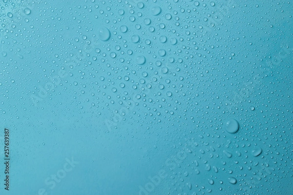 Obraz Drops of water on a blue glass texture background