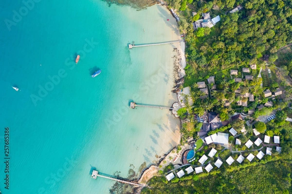 Fototapeta Aerial view. Beautiful tropical beach and wooden bridge in the sea in island Koh Kood Thailand