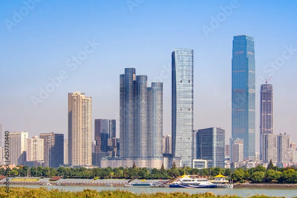 Obraz Tall buildings in Changsha city, Hunan province of China, located at the bank of Xiang river. Chinese cityscape on a clear sunny day.