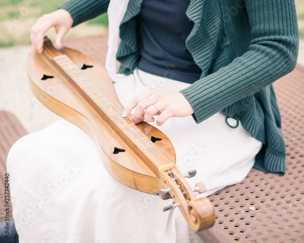 Fototapeta  Girl Seated Playing Mountain Dulcimer
