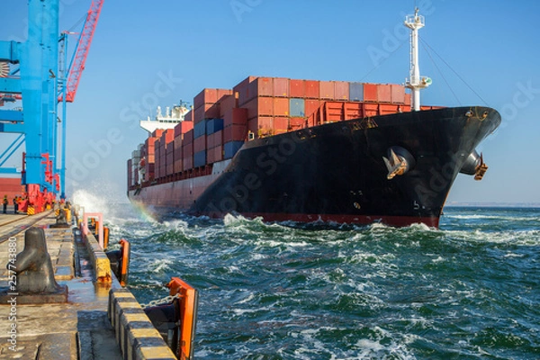 Obraz Container ship in port at container terminal. Ships of container ships stand in terminal of port on loading, unloading container.