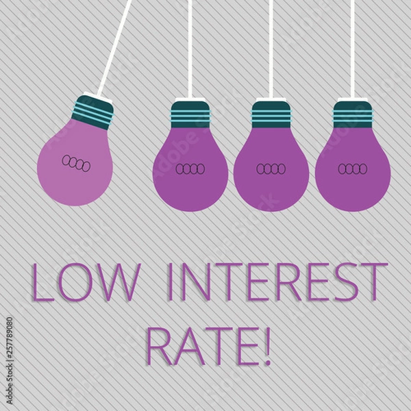 Fototapeta Word writing text Low Interest Rate. Business photo showcasing Manage money wisely pay lesser rates save higher Color Incandescent Pendant Bulb Hanging with One Different Shade Lightbulb