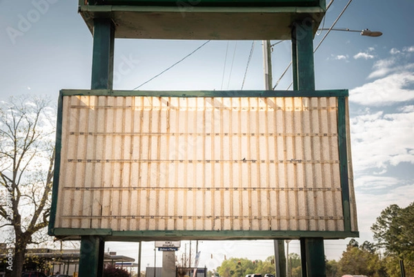 Fototapeta An old, dilapitated and empty changeable letter sign board on a street.