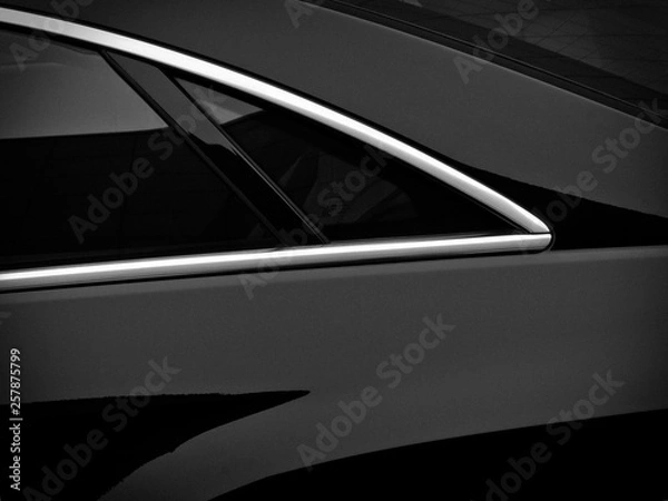 Fototapeta Rear side window on a black passenger car. Fragment
