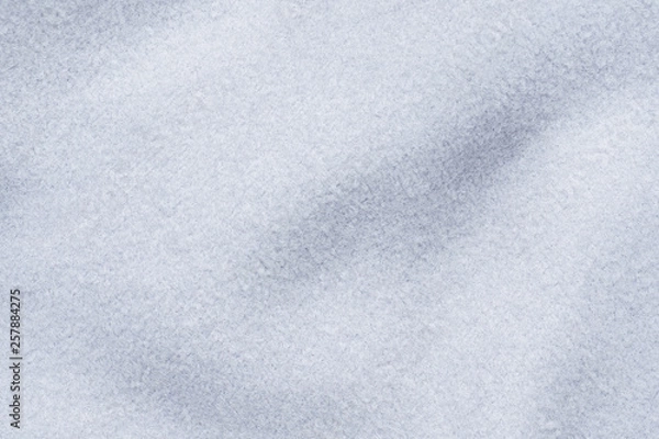 Fototapeta The texture of grey woolen material. Background fabric details.