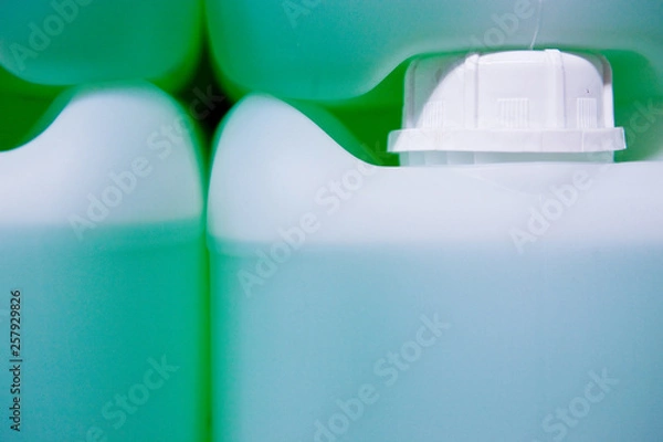 Obraz White drums whit a green liquid inside