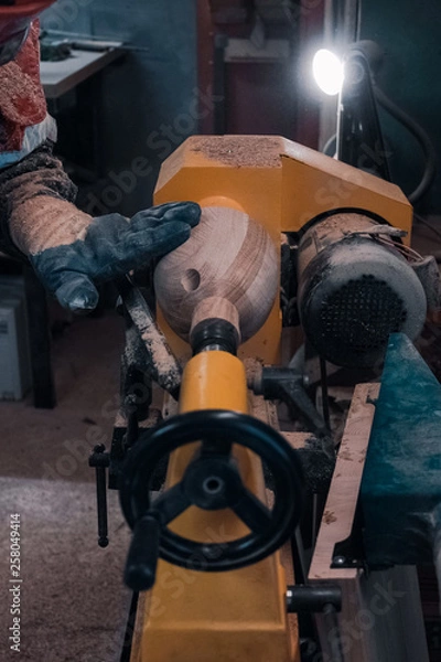 Fototapeta Carpenter working for the machine 