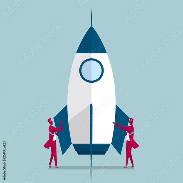 Fototapeta Aerospace industry. Two businessmen are standing on both sides of the rocket. Isolated on blue background.