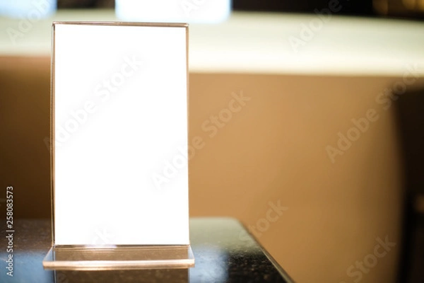 Fototapeta Menu frame space for text marketing promotion standing on wood table in Bar restaurant cafeใ