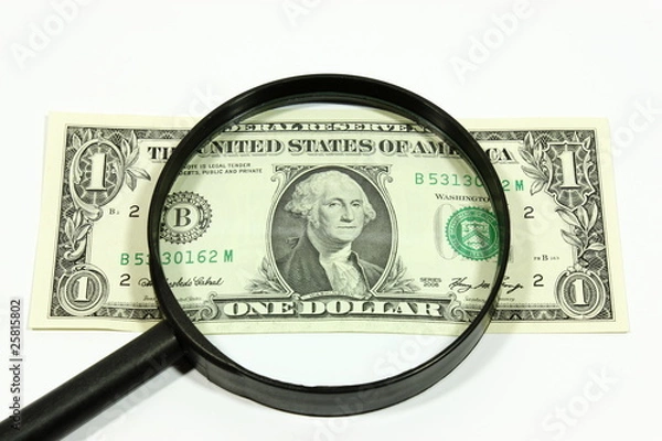 Obraz US dollar with magnifying glass