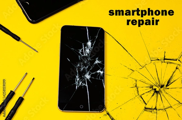 Fototapeta broken smartphone on a yellow background. copy cpace for text