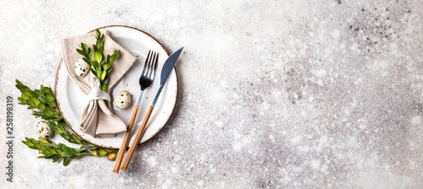 Fototapeta Easter table setting  on on gray background. Holiday decoration.Happy Easter concept. Copy space for Text.
