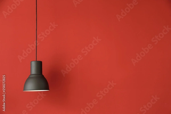 Fototapeta Modern lamp on color background