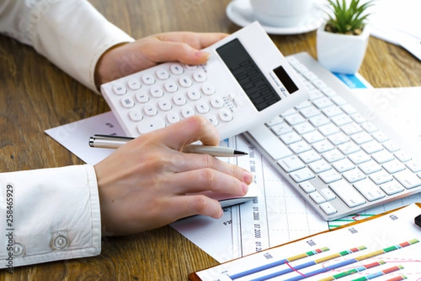 Obraz female hand with objects for doing business in the office