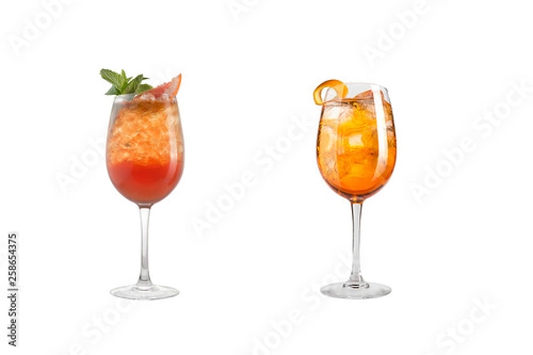 Fototapeta Alcohol cocktail with mint, fruit and berries on a white background. A set of two cocktails in glass goblets on a long leg.