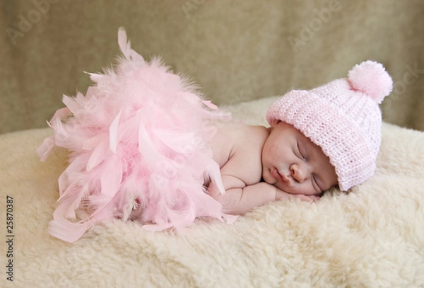 Fototapeta Sleeping Baby Girl Wearing Pink Hat
