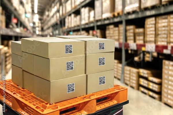Fototapeta Smart logistic industry 4.0 , QR Codes Asset warehouse and inventory management supply chain technology concept. Group of boxes in storehouse can check product inside and order pick time.