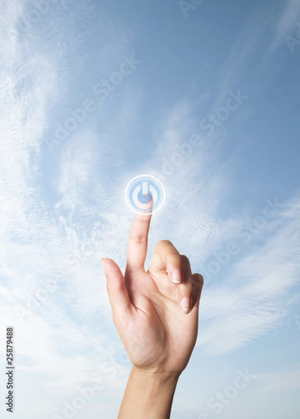 Fototapeta The hand presses the button turn on