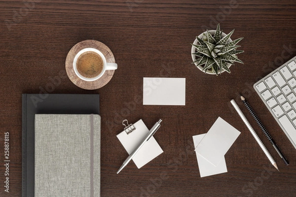 Fototapeta coffee cub notepad notes pen pencil keyboard business car plant  top view with copy space for your text. flat lay. 