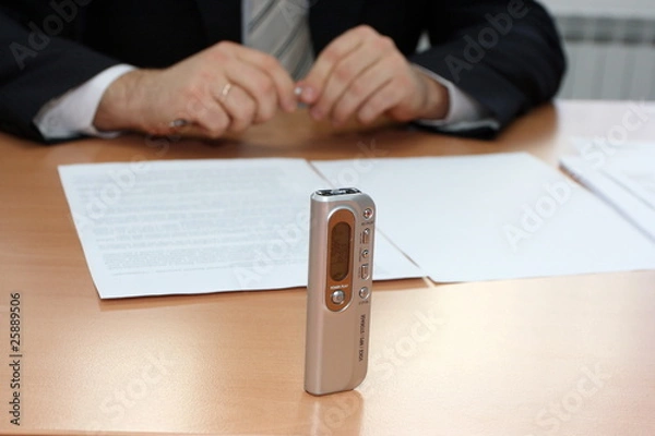 Fototapeta Businessman interviewing with a dictaphone