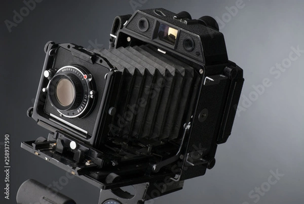 Obraz An old professional camera on gray background