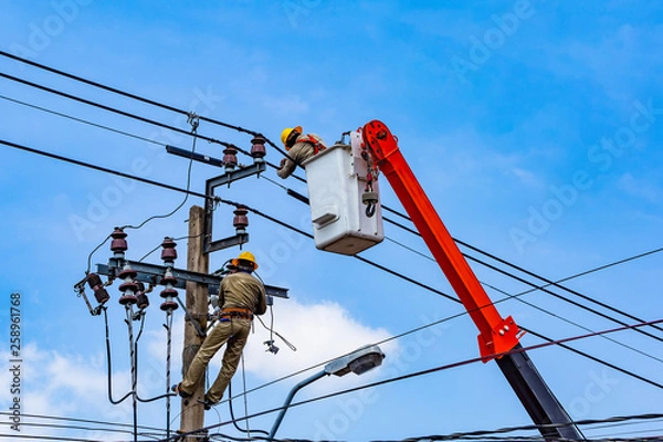 Fototapeta The electrical worker  are repairing the electrical system