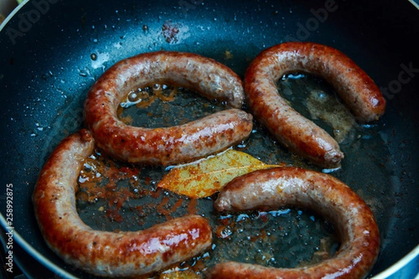 Fototapeta grilled beef sausages with a golden crust