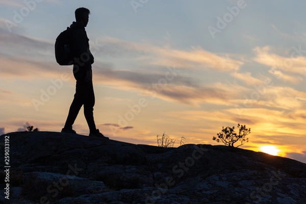 Fototapeta Explorer silhouette in the nature