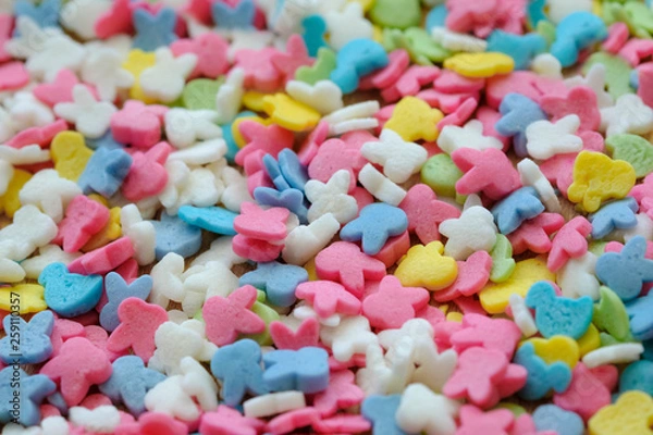 Fototapeta Colorful sugar sprinkles background. Top view with copy space.