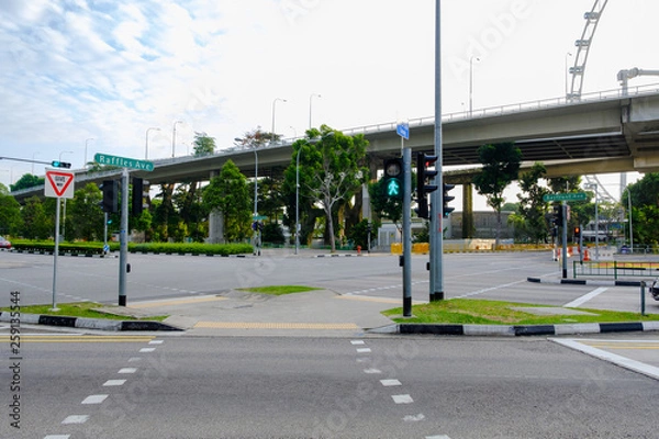 Fototapeta Street in Singapore Clean, orderly There is a clear traffic symbol on the road. And there are also lush green trees
