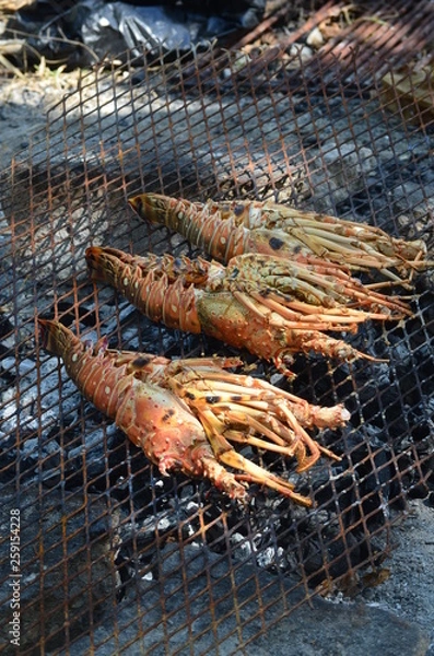 Obraz Grilled Lobster on a Rustic BBQ on the Beach