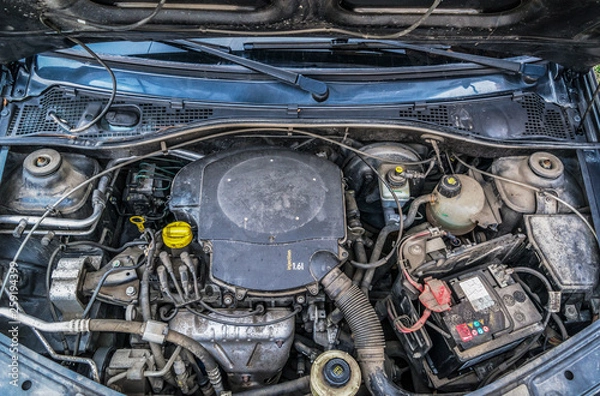 Fototapeta Close up detail of an used and dirty petrol (gasoline) engine. Injection system. Concept of bad car maintenance and engine problems. 
