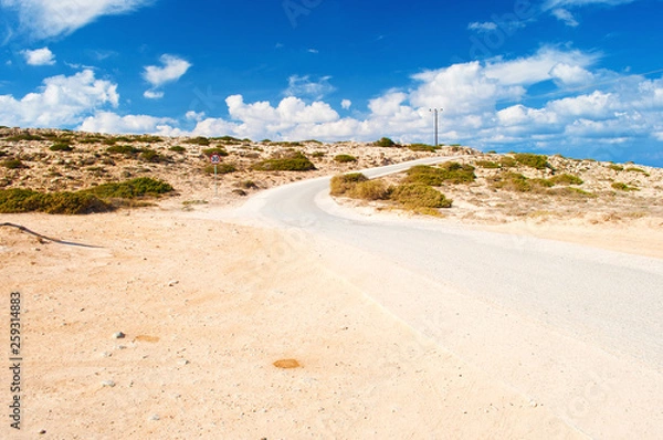 Fototapeta One round road sign with a number 30 near a winding asphalt road near Cape Greco