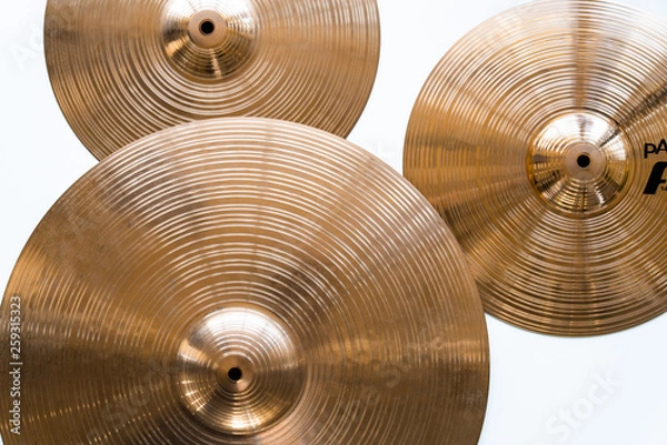 Fototapeta Drum plate, drum set on a white background, musical cymbals top view