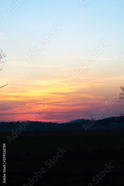 Obraz sky and clouds over hills at sunset