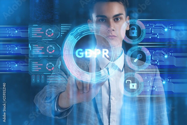 Fototapeta The concept of business, technology, the Internet and the network. A young entrepreneur working on a virtual screen of the future and sees the inscription: GDPR