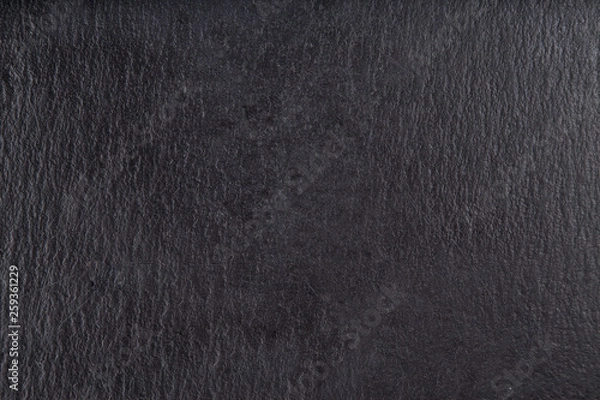 Obraz Cheese basalt stone board, cheese stand, slate platter.  Black stone slate, close up.