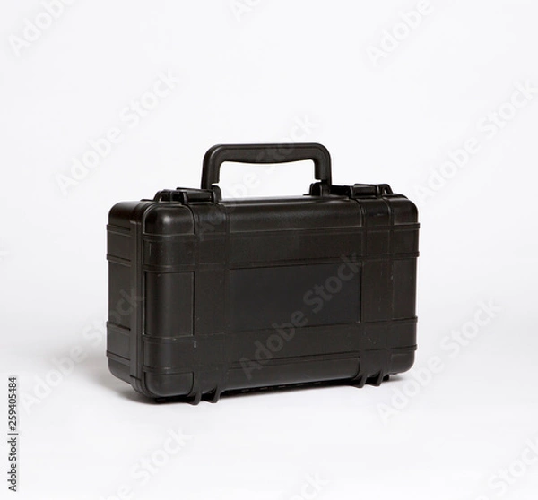 Fototapeta middle size black plastic case on the white background