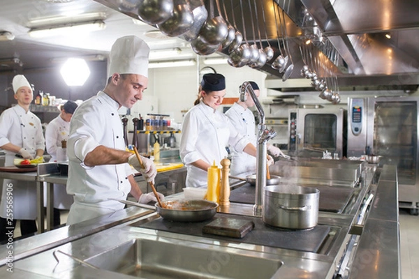 Fototapeta work of a group of chefs in a luxury restaurant.