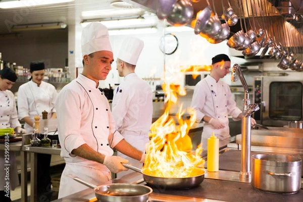 Fototapeta work of a group of chefs in a luxury restaurant.