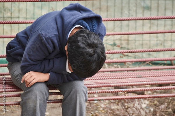Fototapeta sad child, consequences of bullying, Chilean depressive child, emotional illness, problems at school.