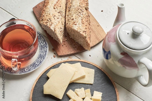 Fototapeta cup of tea and cookies on table