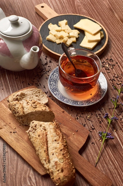 Fototapeta cup of tea and cheese with bread